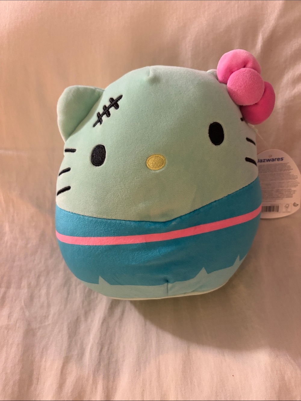 Squishmallows Mint Green & Teal Hello Kitty Plush with Pink Bow